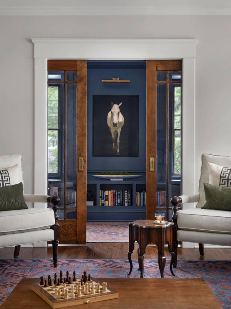 Colonial Revival cottage home office in Decatur featuring antique wood pocket doors, renovated by Copper Sky Design + Remodel.